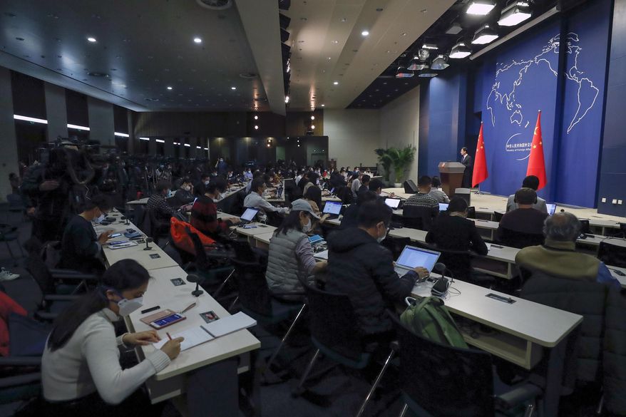 Chinese Foreign Ministry spokesman Geng Shuang speaks during a daily briefing at the Ministry of Foreign Affairs office in Beijing, Wednesday, March 18, 2020. At least 13 American journalists stand to be expelled from China in retaliation for a new limit imposed by the Trump administration on visas for Chinese state-owned media operating in the U.S. (AP Photo/Andy Wong)