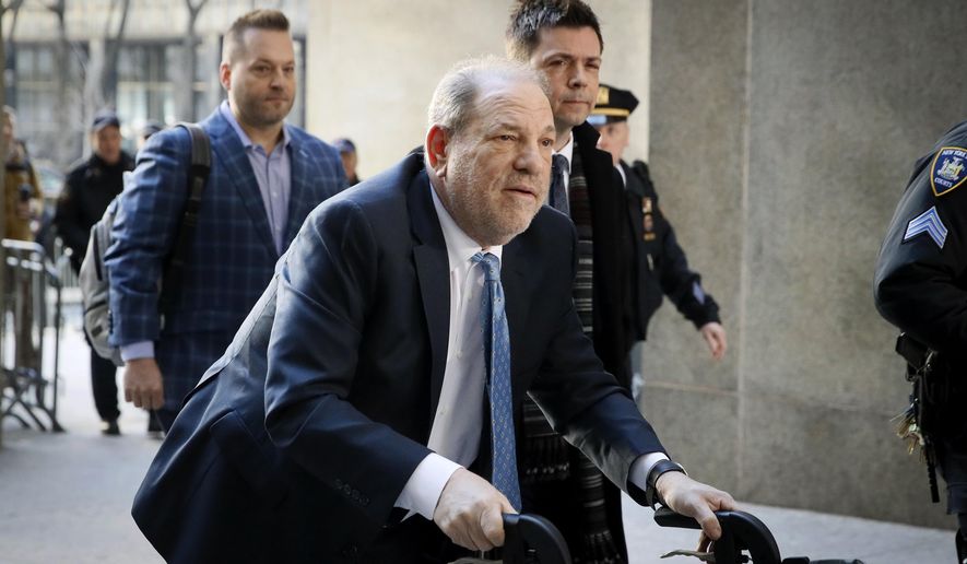 FILE- In this Feb. 24, 2020 file photo, Harvey Weinstein arrives at a Manhattan courthouse as jury deliberations continue in his rape trial in New York. Weinstein was transferred to a state prison in New York on Wednesday, March 18, as he begins to serve a 23-year sentence for rape and sexual assault in his landmark #MeToo case. (AP Photo/John Minchillo, File)