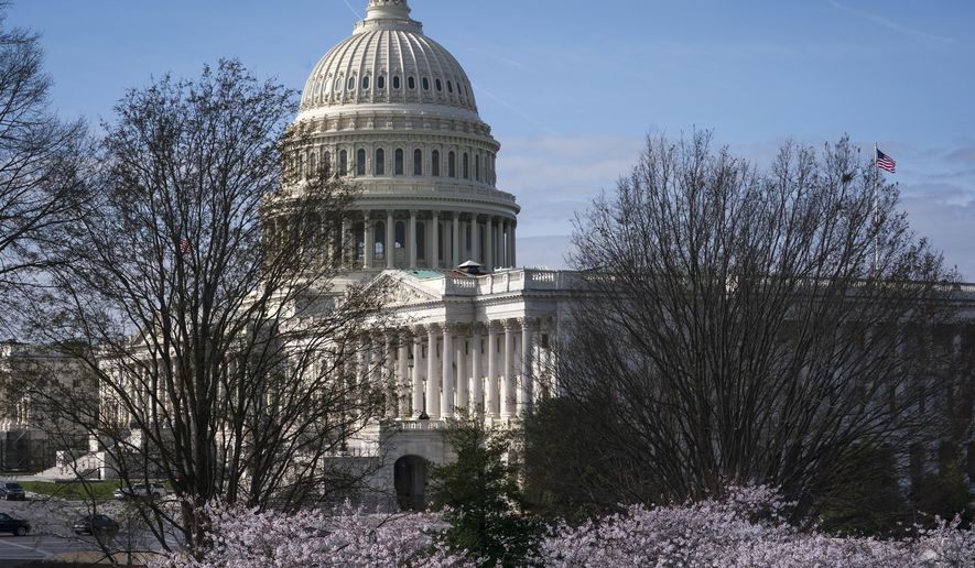 The Capitol is seen as lawmakers negotiate on the emergency coronavirus response legislation, at the Capitol in Washington, Wednesday, March 18, 2020. (AP Photo/J. Scott Applewhite)