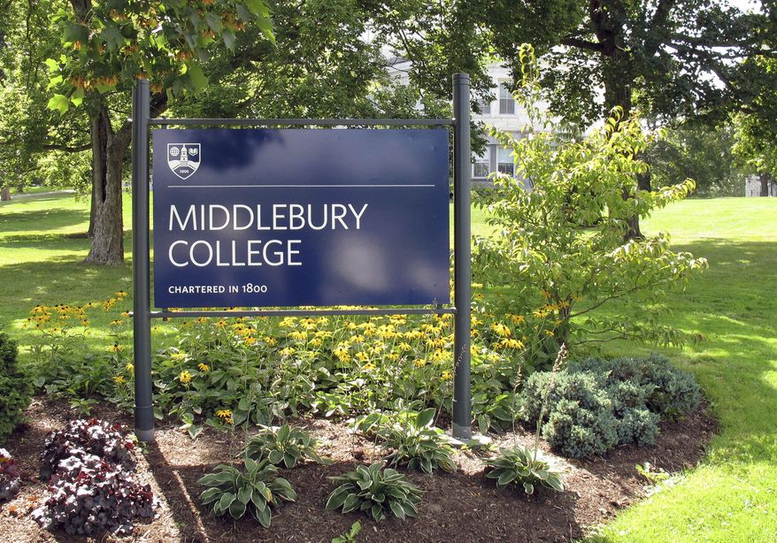 FILE - This Aug. 31, 2017, file photo, shows a sign for Middlebury College on the campus in Middlebury, Vt. Middlebury College in Vermont said it's offering some of its buildings as local officials craft emergency plans to help combat the coronavirus outbreak. (AP Photo/Wilson Ring, File)