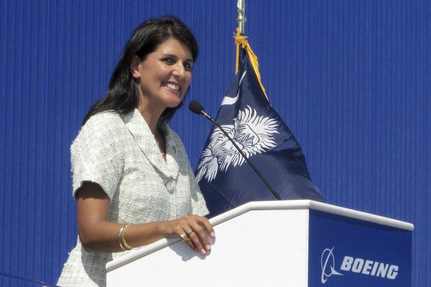In this June 10, 2011, file photo former South Carolina Gov. Nikki Haley speaks during the dedication of Boeing Co.'s $750 million final assembly plant in North Charleston, S.C. Haley has resigned, Thursday, March 19, 2020, from the board of Boeing Co., cutting ties with a company she long supported as South Carolina governor because of her opposition to a bailout of the airplane manufacturer that is in the works amid the growing coronavirus outbreak. (AP Photo/Bruce Smith, file)