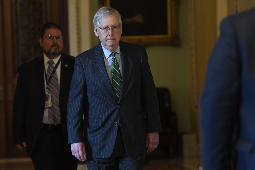 Senate Majority Leader Mitch McConnell of Ky., walks to his office on Capitol Hill in Washington, Thursday, March 19, 2020. (AP Photo/Susan Walsh)