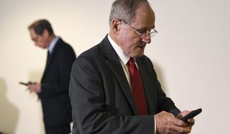 In this file photo, Sen. Jim Risch, R-Idaho, who chairs the Senate Foreign Relations Committee, heads into a Republican policy lunch on Capitol Hill in Washington, Thursday, March 19, 2020. On May 21, Mr. Risch and fellow Republicans on his committee voted to recommend the Senate confirm Michael Pack to head up the U.S. Agency for Global Media. No Democrat on the panel voted in favor of the nomination. (AP Photo/Susan Walsh)