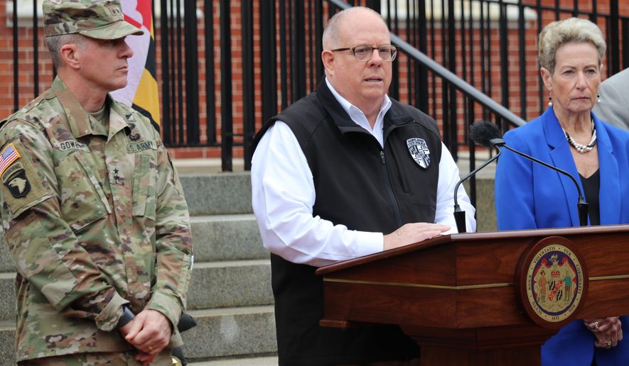 Maryland Gov. Larry Hogan, who chairs the National Governors Association, announces five priorities that governors are asking of the federal government to fight the coronavirus during a news conference Thursday, March 19, 2020 in Annapolis, Md. Maj. Gen. Timothy Gowen, the adjutant general of the Maryland National Guard is standing left. Karen Salmon, Maryland's superintendent of schools, is standing right. (AP Photo/Brian Witte) ** FILE **