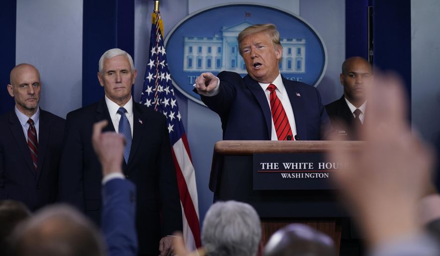 President Donald Trump takes questions during press briefing with the coronavirus task force, at the White House, Thursday, March 19, 2020, in Washington. From left, Food and Drug Administration Commissioner Dr. Stephen Hahn, Vice President Mike Pence, Trump and Surgeon General Jerome Adams. (AP Photo/Evan Vucci)
