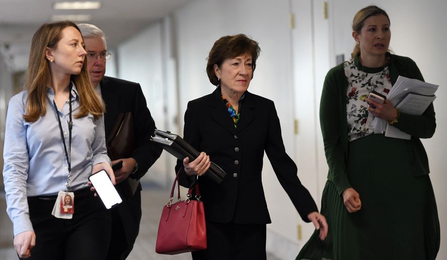 Sen. Susan Collins, R-Maine, arrives for a meeting on Capitol Hill in Washington, Friday, March 20, 2020, to work on an economic package to deal with the coronavirus. (AP Photo/Susan Walsh)