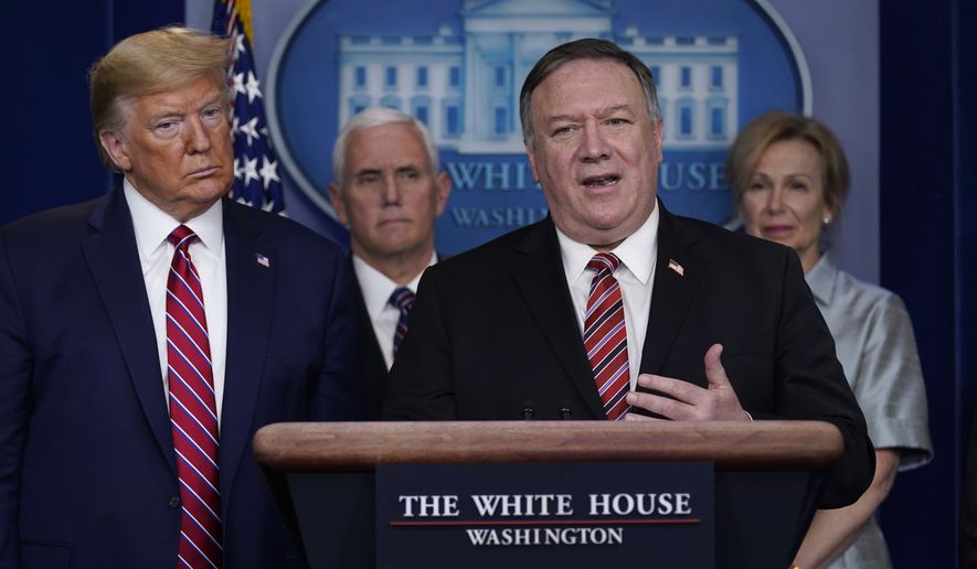 President Donald Trump listens as Secretary of State Mike Pompeo speaks during a coronavirus task force briefing at the White House, Friday, March 20, 2020, in Washington. From left, Trump, Vice President Mike Pence, Pompeo and White House coronavirus response coordinator Dr. Deborah Birx. (AP Photo/Evan Vucci)