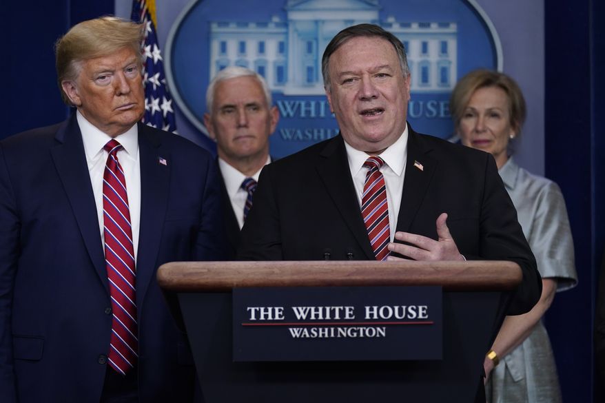 President Donald Trump listens as Secretary of State Mike Pompeo speaks during a coronavirus task force briefing at the White House, Friday, March 20, 2020, in Washington. From left, Trump, Vice President Mike Pence, Pompeo and White House coronavirus response coordinator Dr. Deborah Birx. (AP Photo/Evan Vucci)