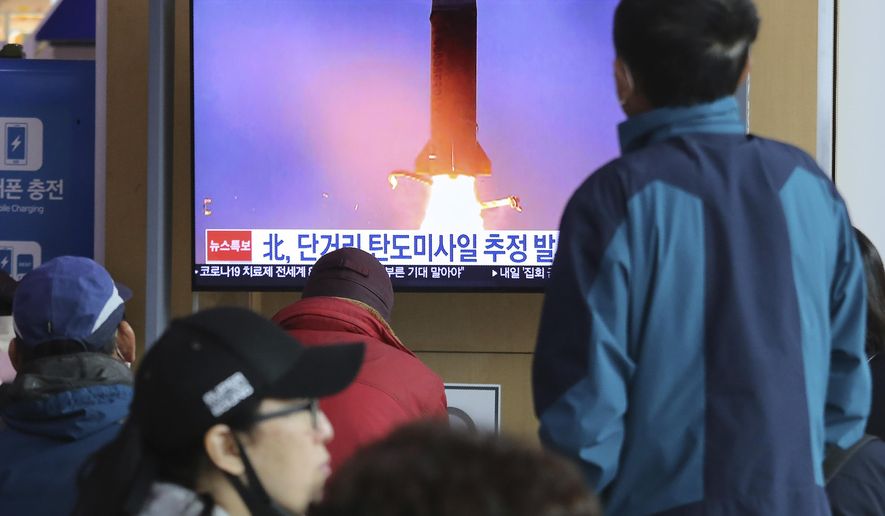 People watches a television screen showing a file image of North Korea's missile launch during a news program at the Seoul Railway Station in Seoul, South Korea, Saturday, March 21, 2020. North Korea on Saturday fired two presumed short-range ballistic missiles into the sea, South Korea's military said, as it continues to expand military capabilities amid deadlocked nuclear negotiations with the Trump administration and a crippling global health crisis. (AP Photo/Ahn Young-joon)