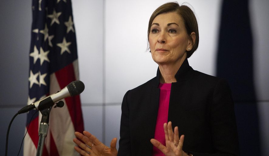 Iowa Gov. Kim Reynolds speaks at a news conference, Thursday, March 19, 2020, at the State Emergency Operations Center in Johnston, Iowa. Gov. Reynolds announced that Iowa now has 44 positive COVID-19 cases and that the state is not considering a shelter-in-place order. (Olivia Sun/The Des Moines Register via AP )