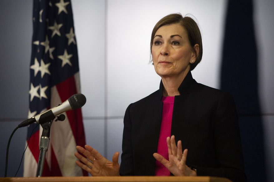 Iowa Gov. Kim Reynolds speaks at a news conference, Thursday, March 19, 2020, at the State Emergency Operations Center in Johnston, Iowa. Gov. Reynolds announced that Iowa now has 44 positive COVID-19 cases and that the state is not considering a shelter-in-place order. (Olivia Sun/The Des Moines Register via AP )