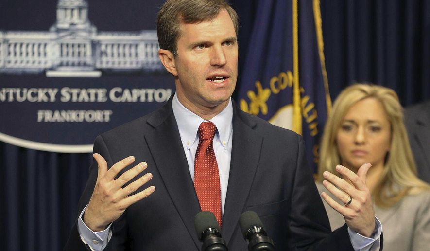In this Tuesday, March 9, 2020 photo, Kentucky Gov. Andy Beshear speaks at a press conference on the coronavirus and Kentucky's steps to combat the outbreak at the capitol in Frankfort, Ky. Kentucky has reported its first death linked to coronavirus. Beshear said Monday, March 16 that the 66-year-old Bourbon County man who died had other health conditions. (Michael Clevenger/Courier Journal via AP)