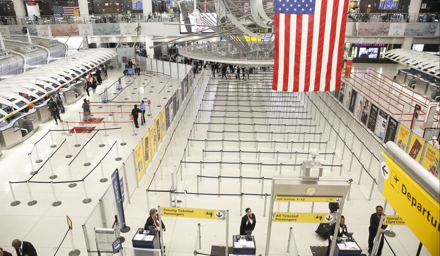 The area for TSA screening of travelers at JFK airport&#x27;s Terminal 1 is relatively empty, Friday, March 13, 2020, in New York. (AP Photo/Kathy Willens)