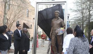 In this Wednesday, March 18, 2020 photo, the city of Florence, S.C. unveils a statue of William H. Johnson in the West Evans Street Breezeway. (Matthew Christian/The Morning News via AP)