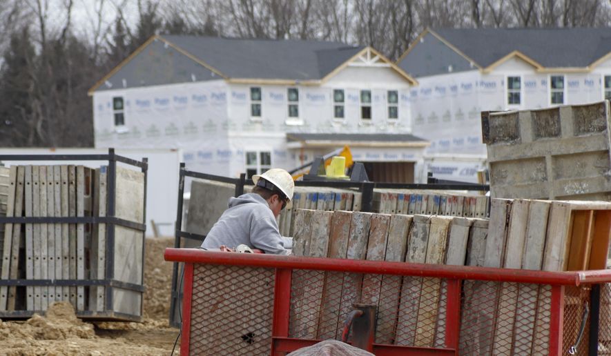 Construction continues at a housing plan in Zelienople, Pa., Wednesday, March 18, 2020.  Economic and housing market trends at the start of the year both favored U.S. homebuilders&#x27; prospects for 2020. That was then. But with the coronavirus outbreak now expected to tip the U.S. into recession, the National Association of Home Builders projects that new home construction and sales will take a hit as efforts to contain its spread disrupt large swaths of the economy.  (AP Photo/Keith Srakocic)