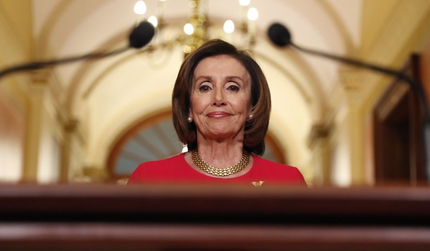 House Speaker Nancy Pelosi of Calif., arrives to speak outside her office on Capitol Hill, Monday, March 23, 2020. (AP Photo/Andrew Harnik, Pool)