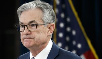 In this Tuesday, March 3, 2020, file photo, Federal Reserve Chair Jerome Powell pauses during a news conference to discuss an announcement from the Federal Open Market Committee, in Washington. (AP Photo/Jacquelyn Martin, File)