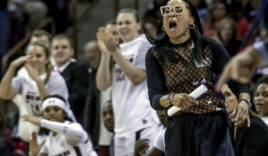 FILE - In this Jan. 2, 2020, file photo, South Carolina coach Dawn Staley disputes a call during the second half of an NCAA college basketball game against Kentucky in Columbia, S.C. Staley was announced as The Associated Press women's basketball coach of the year Monday, March 23, 2020. (Tracy Glantz/The State via AP, File)