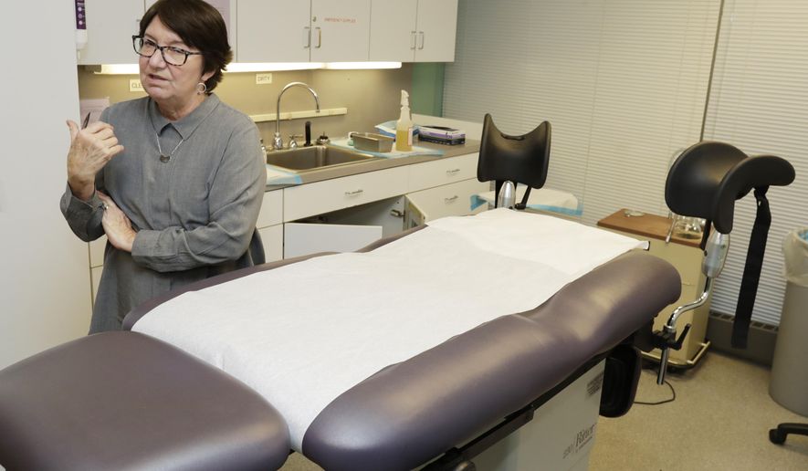 FILE - In this Feb. 25, 2020, file photo, Executive Director Chrisse France talks about Preterm, the busiest abortion clinic in Ohio, in the procedure room in Cleveland. The governor and attorney general of Texas are moving to ban most abortions in the state during the coronavirus outbreak, declaring they don't qualify as essential surgeries. (AP Photo/Tony Dejak, File)