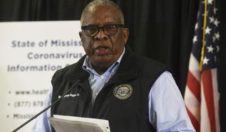 Mayor George Flaggs Jr. proclaims a civil emergency due to the spread of the COVID-19 coronavirus during a news conference at the Vicksburg Convention Center in Vicksburg, Miss., Sunday, March 22, 2020. Starting Monday at noon, measures such as a curfew, adjusted business hours, limitations on business services, social distancing and limitations on gatherings will be held for the next 14 days. (Courtland Wells/The Vicksburg Post via AP)