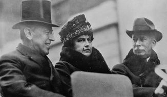 In this Oct. 11, 1918, file photo first lady Edith Wilson, center, and President Woodrow Wilson, left, arrive in New York to take part in the Liberty Day Parade. Woodrow Wilson was more focused on the end of World War I than a flu virus that was making its way around the globe, ultimately sickening hundreds of thousands of Americans, including him. (AP Photo, File)
