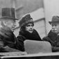 In this Oct. 11, 1918, file photo first lady Edith Wilson, center, and President Woodrow Wilson, left, arrive in New York to take part in the Liberty Day Parade. Woodrow Wilson was more focused on the end of World War I than a flu virus that was making its way around the globe, ultimately sickening hundreds of thousands of Americans, including him. (AP Photo, File)