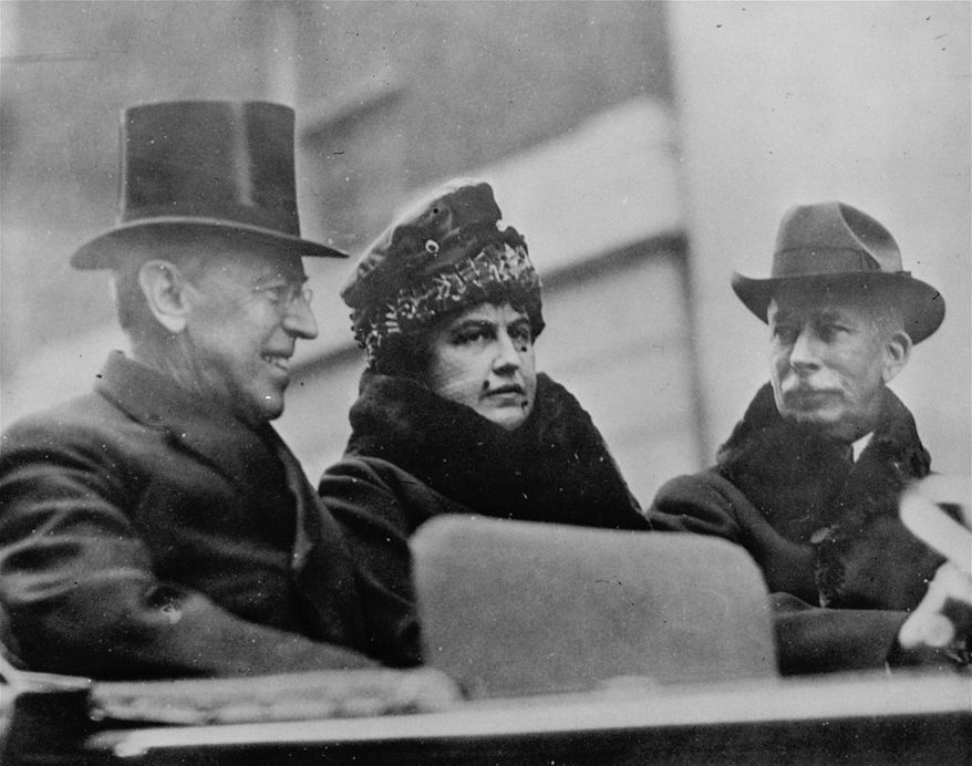 In this Oct. 11, 1918, file photo first lady Edith Wilson, center, and President Woodrow Wilson, left, arrive in New York to take part in the Liberty Day Parade. Woodrow Wilson was more focused on the end of World War I than a flu virus that was making its way around the globe, ultimately sickening hundreds of thousands of Americans, including him. (AP Photo, File)