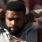 In this Oct. 21, 2018, file photo, Washington Redskins offensive tackle Trent Williams takes the field for warm-ups before an NFL football game against the Dallas Cowboys, in Landover, Md. (AP Photo/Andrew Harnik)  ** FILE **