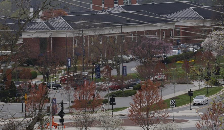 Liberty University&#x27;s Freedom Tower looms over campus as students were welcomed back to the university&#x27;s campus, Tuesday March 24 , 2020, in Lynchburg, Va. Officials in Lynchburg, said Tuesday they were fielding complaints and concerns about the hundreds of students that have returned from their spring break to Liberty University, where President Jerry Falwell Jr. has welcomed them back amid the coronavirus pandemic. (AP Photo/Steve Helber)