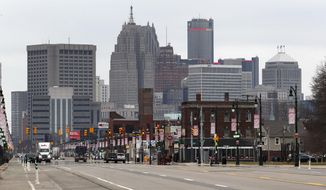 Michigan Avenue is shown nearly empty Tuesday, March 24, 2020 in Detroit. Gov. Gretchen Whitmer told Michigan residents to stay at home beginning Tuesday, in her most sweeping order of the coronavirus crisis. (AP Photo/Paul Sancya)