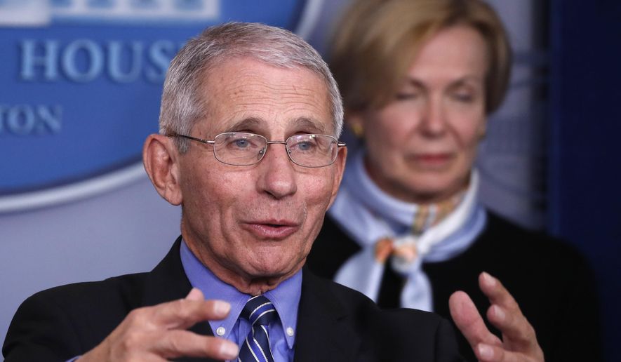 Dr. Anthony Fauci, director of the National Institute of Allergy and Infectious Diseases, speaks about the coronavirus in the James Brady Briefing Room, Tuesday, March 24, 2020, in Washington, as Dr. Deborah Birx, White House coronavirus response coordinator, listens. (AP Photo/Alex Brandon)