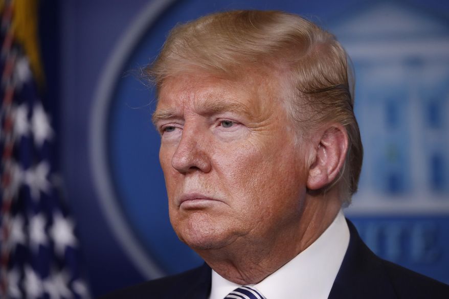 President Donald Trump listens during a briefing about the coronavirus in the James Brady Briefing Room, Monday, March 23, 2020, in Washington. (AP Photo/Alex Brandon)
