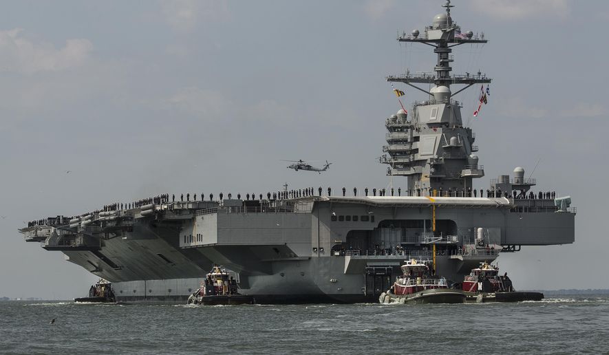 In this April 14, 2017, photo, as crew members stand on the deck, the aircraft carrier USS Gerald R. Ford heads to the Norfolk, Va., naval station. Toilets on the USS Gerald R. Ford and USS George H.W. Bush carriers that have become repeatedly clogged could require treatments costing $400,000 each to get them working properly, a U.S. Government Accountability Office report found.  (Bill Tiernan/The Virginian-Pilot via AP) **FILE**
