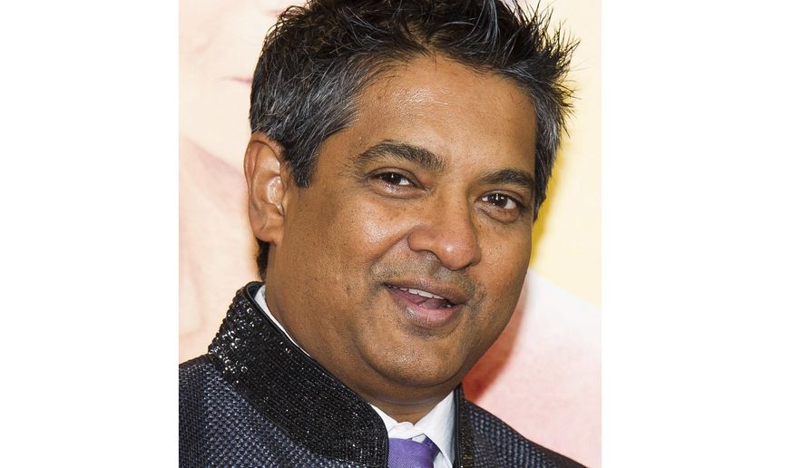 FILE - This Aug. 4, 2014 file photo shows chef Floyd Cardoz at "The Hundred-Foot Journey" premiere in New York. Cardoz, who competed on “Top Chef,” won “Top Chef Masters” and operated successful restaurants in both India and New York, has died of complications from the coronavirus, his company said Wednesday. He was 59. (Photo by Charles Sykes/Invision/AP, File)
