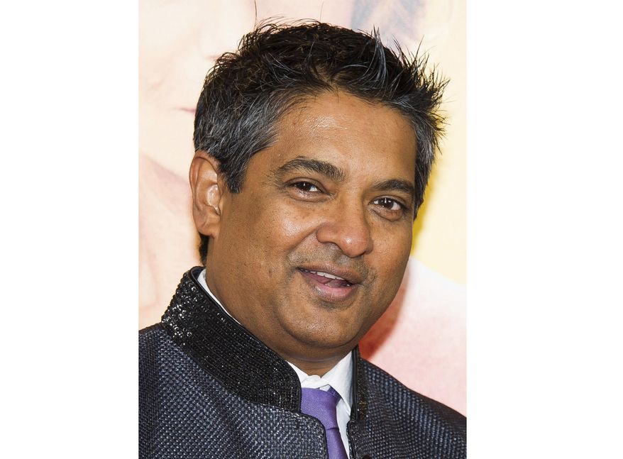FILE - This Aug. 4, 2014 file photo shows chef Floyd Cardoz at "The Hundred-Foot Journey" premiere in New York. Cardoz, who competed on “Top Chef,” won “Top Chef Masters” and operated successful restaurants in both India and New York, has died of complications from the coronavirus, his company said Wednesday. He was 59. (Photo by Charles Sykes/Invision/AP, File)