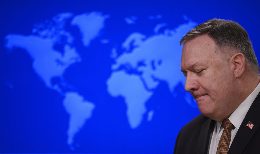 Secretary of State Mike Pompeo speaks during a news conference at the State Department on Wednesday, March 25, 2020, in Washington. Pompeo said Wednesday that the Group of Seven members were all aware of China&#39;s &amp;quot;disinformation campaign&amp;quot; regarding the coronavirus outbreak, as the two countries dispute the origins of the disease. (Andrew Caballero-Reynolds/Pool Photo via AP)