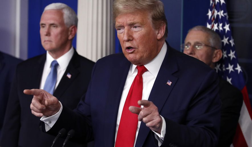 President Donald Trump speaks about the coronavirus in the James Brady Briefing Room, Tuesday, March 24, 2020, in Washington, as Vice President Mike Pence and Dr. Anthony Fauci, director of the National Institute of Allergy and Infectious Diseases, listen. (AP Photo/Alex Brandon)