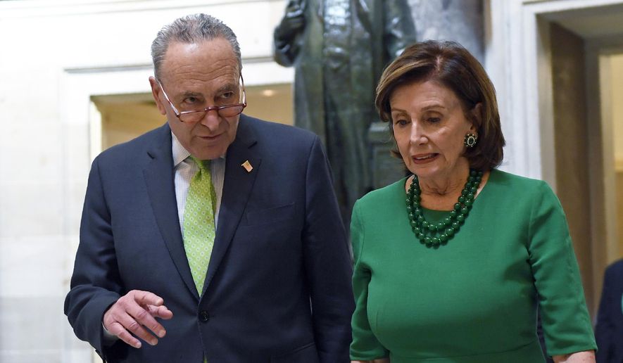 In this March 12, 2020, file photo, Senate Minority Leader Sen. Chuck Schumer of N.Y., and House Speaker Nancy Pelosi of Calif., walks together as they head to a lunch with Irish Prime Minister Leo Varadkar on Capitol Hill in Washington. (AP Photo/Susan Walsh, File)
