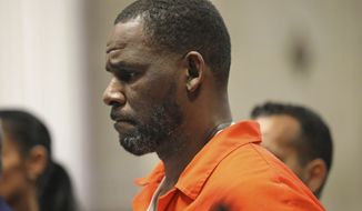In this Sept. 17, 2019, file photo, R. Kelly appears during a hearing at the Leighton Criminal Courthouse in Chicago. In a court filing Thursday, March 26, 2020, R Kelly cited the novel coronavirus in asking a federal judge to free him from a federal jail in Chicago as he awaits trial on child pornography and other charges. (Antonio Perez/Chicago Tribune via AP, Pool, File)