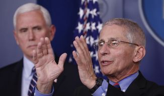 Dr. Anthony Fauci, director of the National Institute of Allergy and Infectious Diseases, speaks about the coronavirus in the James Brady Briefing Room, Wednesday, March 25, 2020, in Washington, as Vice President Mike Pence listens. (AP Photo/Alex Brandon)
