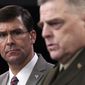 Defense Secretary Mark Esper, left, listens as Chairman of the Joint Chiefs of Staff Army Gen. Mark Milley, right, speaks during a briefing at the Pentagon in Washington, Monday, March 2, 2020. (AP Photo/Susan Walsh)
