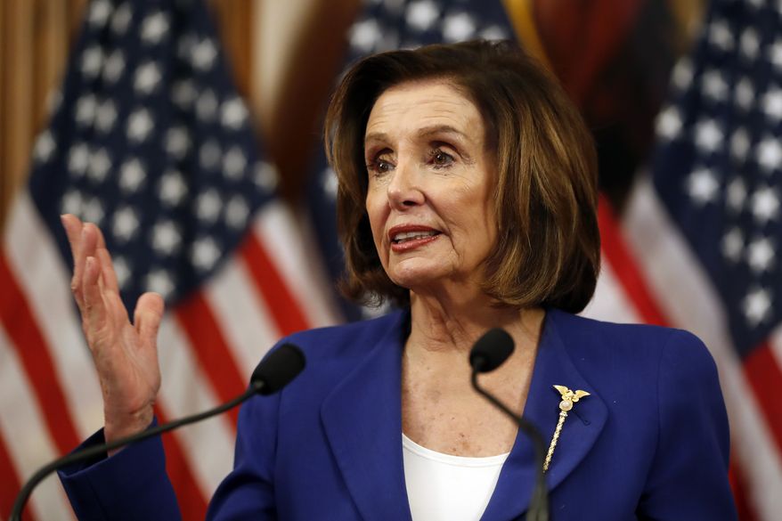 House Speaker Nancy Pelosi of Calif. speaks before she signs the Coronavirus Aid, Relief, and Economic Security (CARES) Act. after it passed in the House on Capitol Hill, Friday, March 27, 2020., in Washington. (AP Photo/Andrew Harnik)