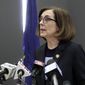 FILE - In this Monday, March 16, 2020 file photo, Gov. Kate Brown speaks at a news conference to announce a four-week ban on eat-in dining at bars and restaurants throughout the state in Portland, Ore., to slow the spread of the new coronavirus. I am gravely concerned about our ability to deliver basic services over the next six months to a year given the drop in revenues, and thats why I am encouraging the Legislature to be extremely fiscally prudent, Brown, a Democrat, said about building the budget for the coming fiscal year. (AP Photo/Gillian Flaccus)