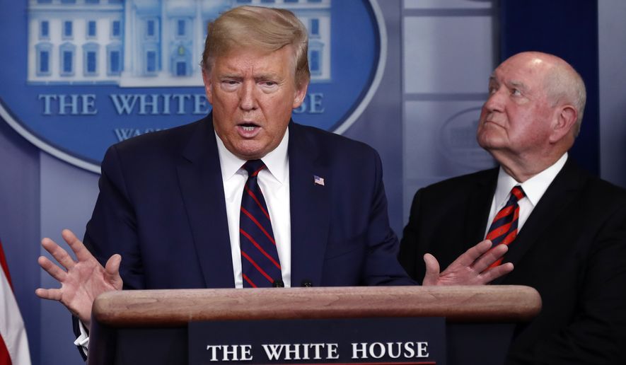 President Donald Trump speaks about the coronavirus in the James Brady Press Briefing Room, Friday, March 27, 2020, in Washington, as Agriculture Secretary Sonny Perdue listens. (AP Photo/Alex Brandon)