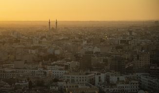 The sun rises over Tripoli, Libya, Friday, Feb. 28, 2020. (AP Photo/Felipe Dana)