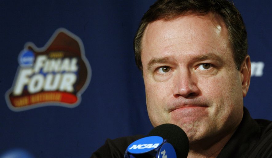FILE - In this Sunday, April 6, 2008, file photo, Kansas head coach Bill Self listens to a question at a news conference before Monday's championship game against Memphis at the NCAA college basketball Final Four in San Antonio. The NCAA and networks across the sports dial have infused fans with a hoops fix by rebroadcasting epic NCAA Tournament games. Coaches and players involved in those games are adding insight and a dash of humor by live tweeting during the replay. (AP Photo/Charlie Neibergall, File)