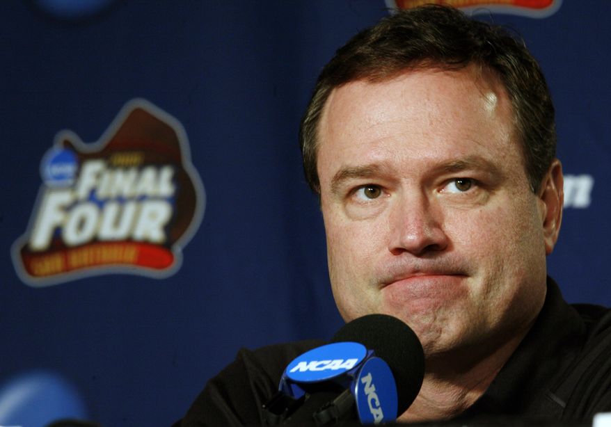 FILE - In this Sunday, April 6, 2008, file photo, Kansas head coach Bill Self listens to a question at a news conference before Monday's championship game against Memphis at the NCAA college basketball Final Four in San Antonio. The NCAA and networks across the sports dial have infused fans with a hoops fix by rebroadcasting epic NCAA Tournament games. Coaches and players involved in those games are adding insight and a dash of humor by live tweeting during the replay. (AP Photo/Charlie Neibergall, File)