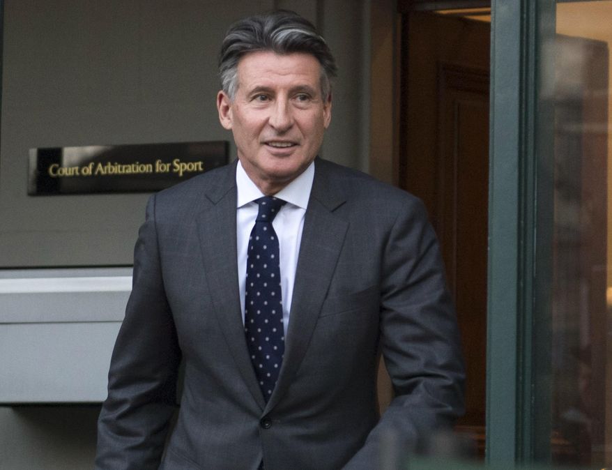 FILE - In this Monday, Feb. 18, 2019, file photo, Sebastian Coe leaves the Court of Arbitration for Sport in Lausanne, Switzerland. The date of the next world track championships is in limbo until the International Olympic Committee decides on a new schedule for the postponed Tokyo Games.Coe, the Olympic great who is now president of World Athletics, said Friday, March 27, 2020, there are plenty of options for rescheduling next year's world championships in Eugene, Oregon, but at the moment they all depend on the IOC. (Laurent Gillieron/Keystone via AP, File)
