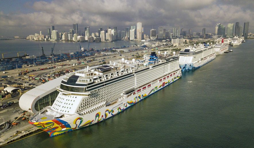 The Norwegian Encore cruise ship is docked at the Port of Miami on Thursday, March 26, 2020, in Miami, Fla. (Al Diaz/Miami Herald via AP)