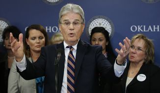 In this March 28, 2018, file photo, former U.S. Sen. Tom Coburn speaks at a news conference in Oklahoma City.  Coburn has died. He was 72. A cousin tells The Associated Press that he died early Saturday, March 28, 2020. Coburn had been diagnosed with prostate cancer years earlier. The Oklahoma Republican railed against federal earmarking and earned a reputation as a political maverick. (AP Photo/Sue Ogrocki, File)